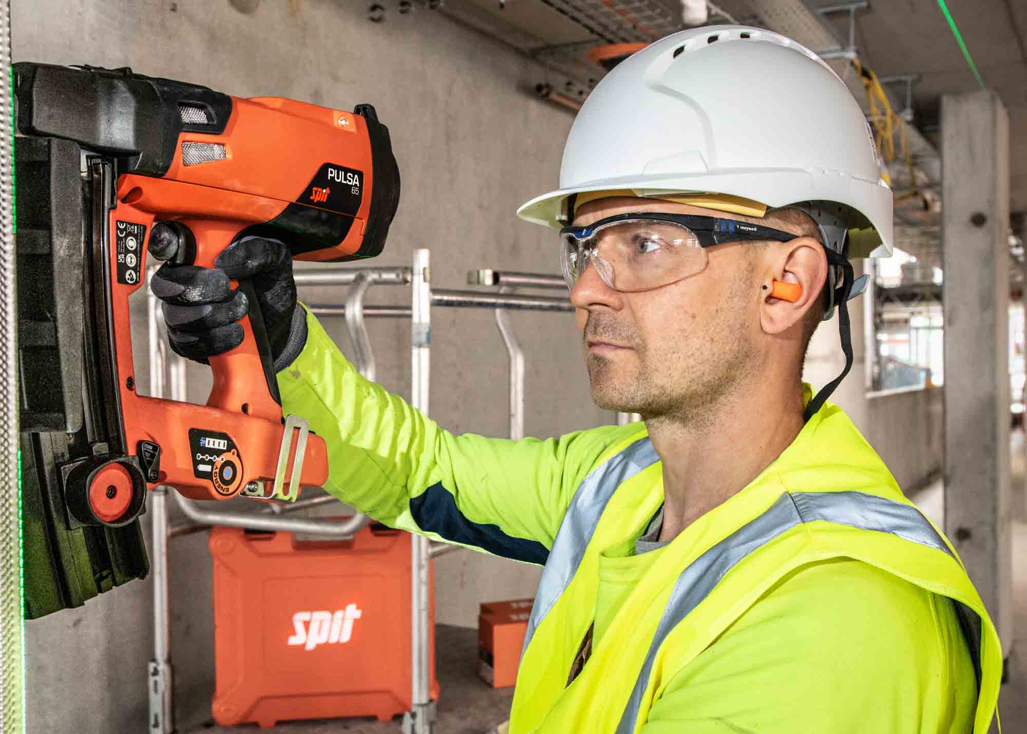 Professional brand photography of construction worker using branded tools